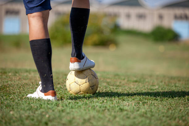 istock FootGolf Player Leg on Soccer Ball 858486608