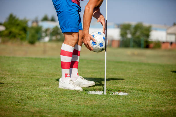 istock Footgolf Player Picking Soccer Ball from the Hole 858486610