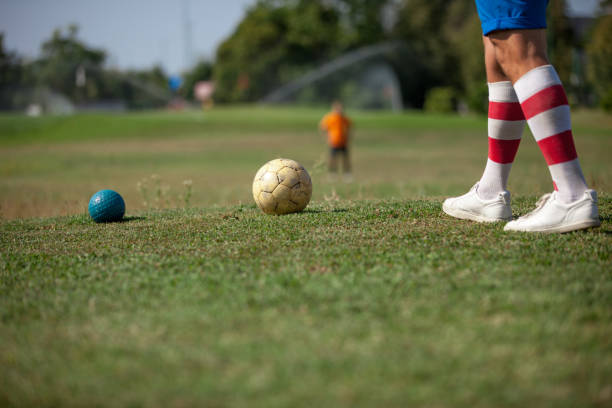 istock FootGolf Athlete Legs in Striped Socks Close-up 858486652