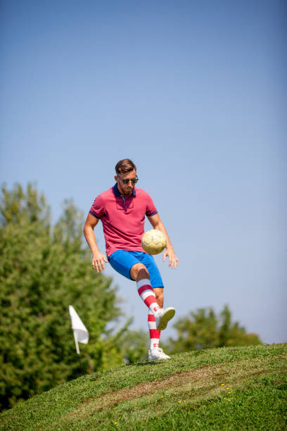 istock FootGolf Player Kicking Soccer Ball 858486690