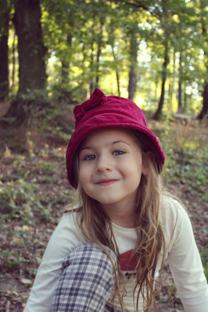 istock beautiful little girl with hat posing 858492984