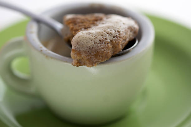 istock dipping a cookies in espresso coffee 858503798
