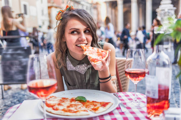 istock Attractive young woman having meal in Rome 858503916