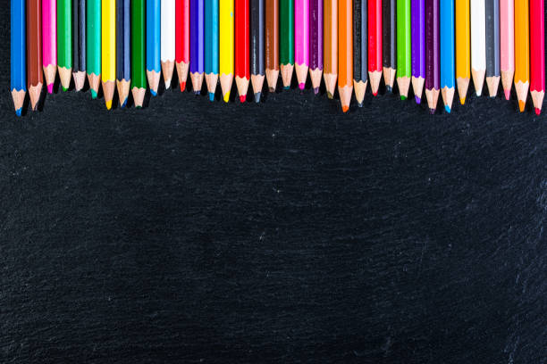 istock Colorful pencils on black, copy space, back to school concept 858503994