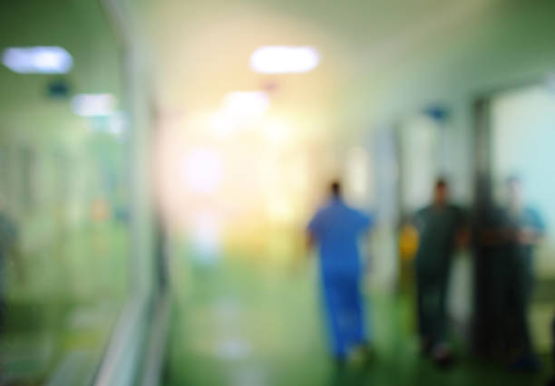 istock Unfocused hospital hall with doctor silhouette 858504502