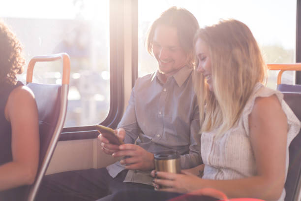 istock Young couple in their 20s rides the train together 858508466