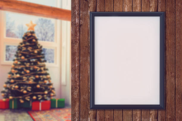 istock Blank poster frame on the wall with out of focus Christmas background 858511174