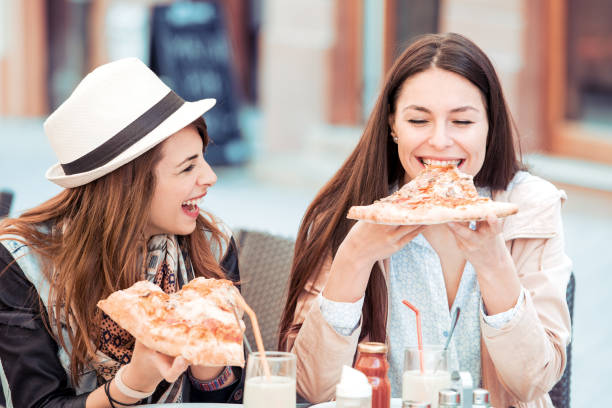istock Two women having lunch outdoors 858518442