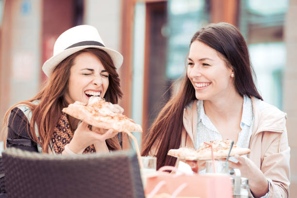 istock Two women having lunch outdoors 858518452