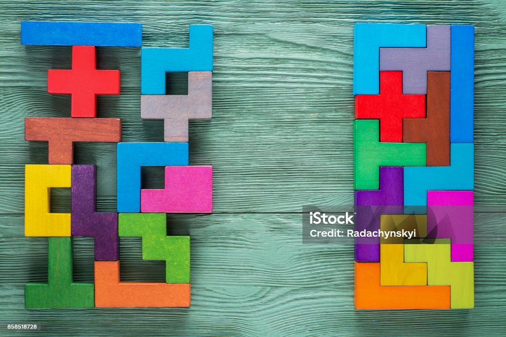 Logical tasks composed of colorful wooden shapes. Business concept. Logical tasks composed of colorful wooden shapes, top view. Visual conundrum. Concept of creative, logical thinking or problem solving. Business concept, rational solution. Change Stock Photo