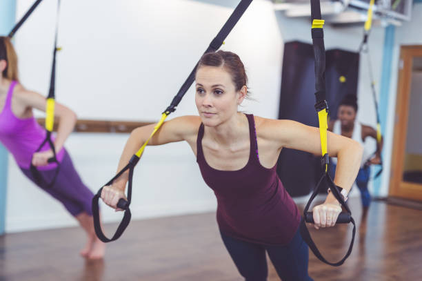 istock Group of Women Doing TRX Workout 858519566