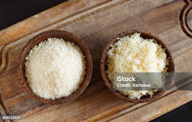 Bowls With Grated Parmesan Cheese Stock Photo - Download Image Now - Grated, Parmesan Cheese, Bowl