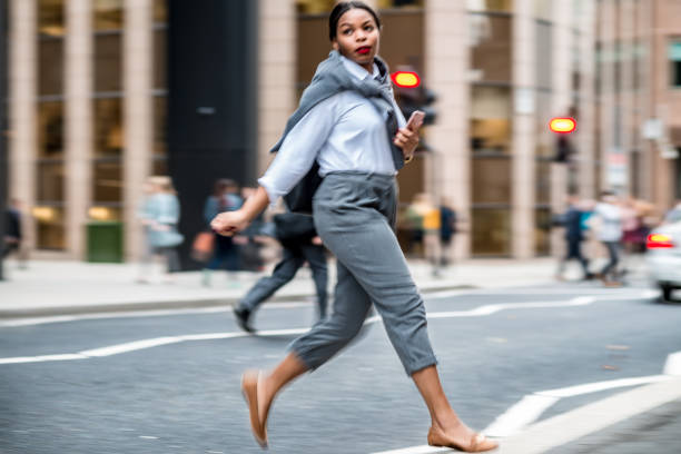 istock Businesswoman crossing road 858526038