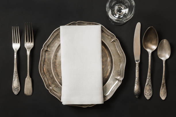 istock Vintage dish with silverware for lunch on black background. Table place setting. 858526728