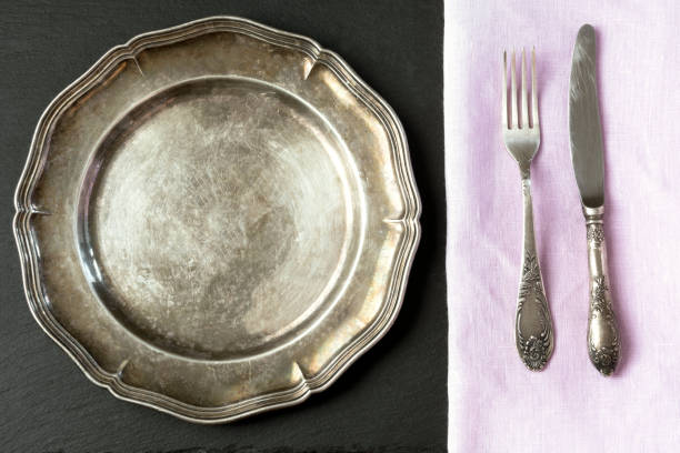 istock Vintage metal dish with silverware on slate background. Table place setting. 858526746