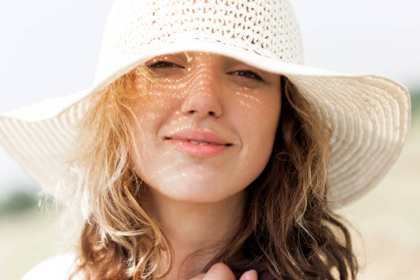 istock Girl with hat on summer sun 858531712