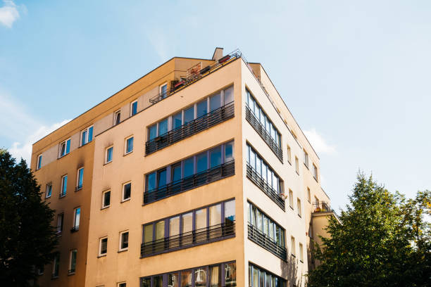 istock brown facaded apartment building with long windows 858537460