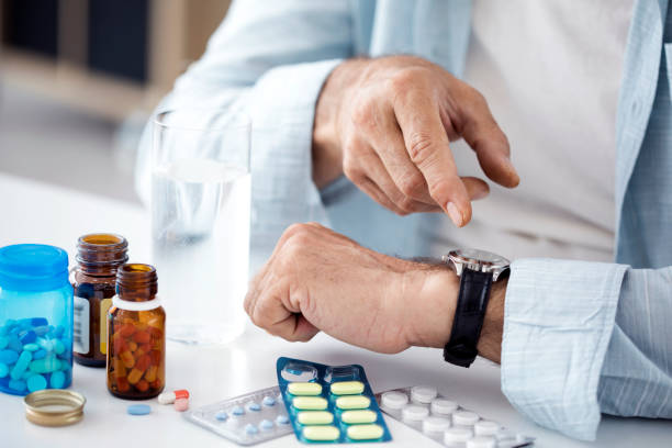 istock Time to take pills for old man 858537728