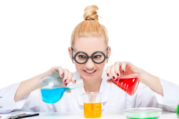 funny laboratory assistant chemist mixes fluids in test tubes