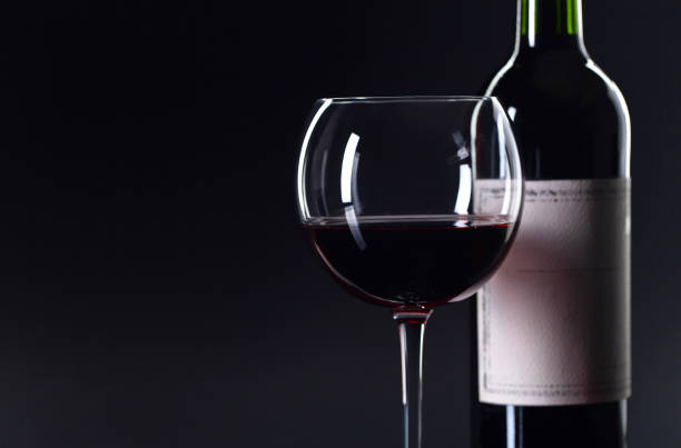 istock Bottle and glass of red wine . 858546856