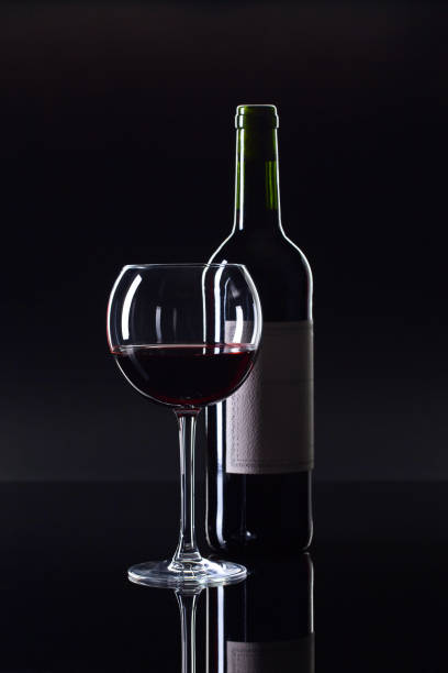 istock Bottle and glass of red wine . 858546892