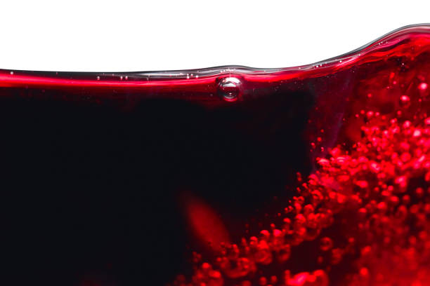istock Abstract splashes of red wine on white background. 858546936