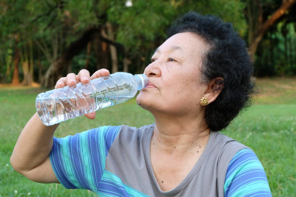 istock Asian Senior woman drinking water 858549478