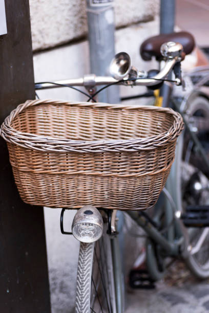 istock vintage bicycle with wicker basket placed on a wall 858549622