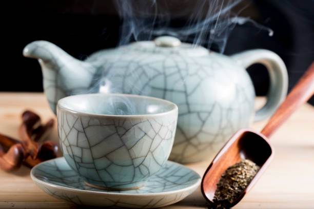 istock Traditional cup of steaming tea with accessories 858549786