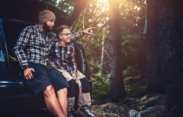 istock Father and son travelling by car 858561098