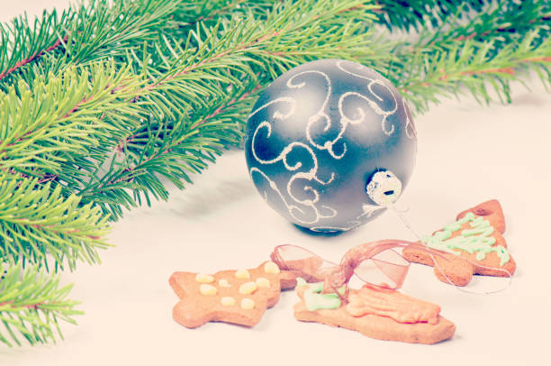 istock Gingerbread cookies with christmas tree and ball, retro toned 858561354
