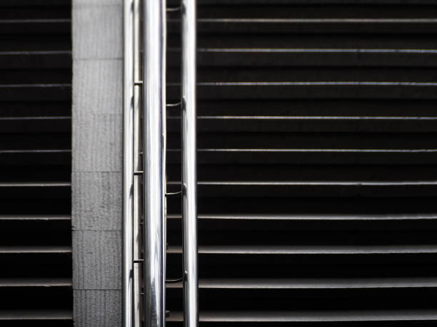 istock Infrastructure stairs: railing, chrome plated handrail, slope ramp for wheelchairs. Construction background 858564532