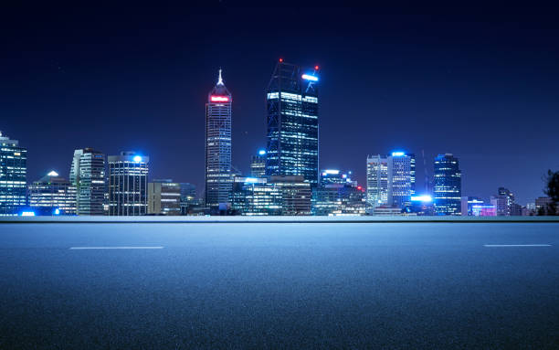 istock Side view asphalt road on snight scene near the modern city . 858565136
