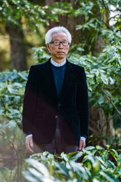 istock Japanese senior man standing outside 858568596