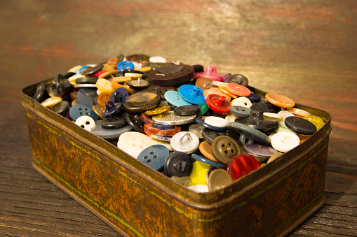 The old buttons. Buttons in an old metal box.