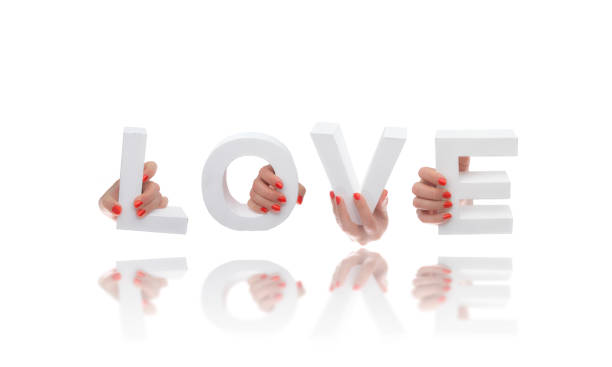 istock Hands holding up the positive word love 858575666