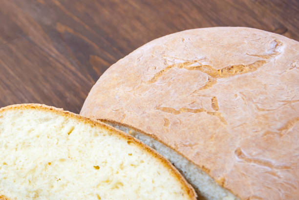 istock The bake fresh bread at home. Fresh, crusty bread. Natural product. 858576016