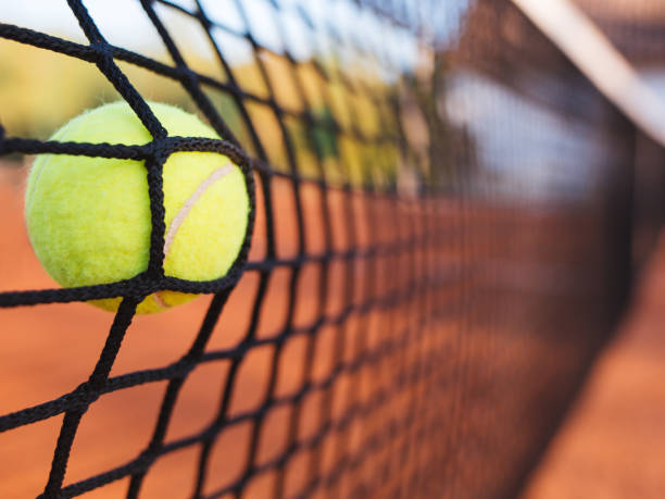 istock Tennis ball hitting the net 858579178