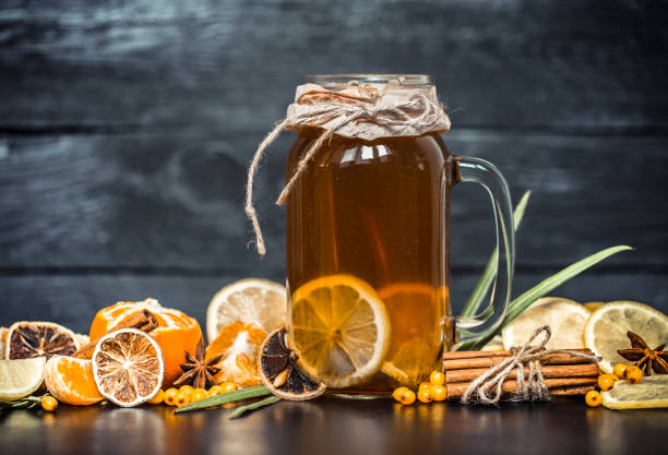 istock the composition of tea with lemon on a black background 858580386