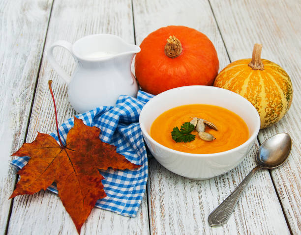 istock Pumpkin soup with fresh pumpkins 858580508