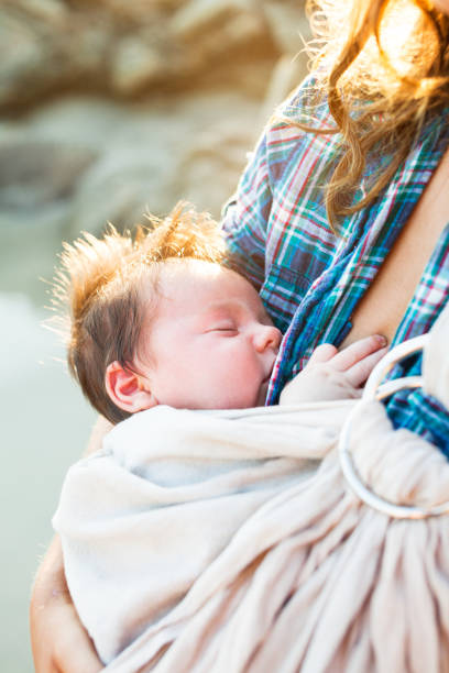 istock mother holding baby 858581216