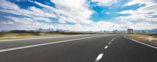 istock empty asphalt road and cityscape of modern city 858583302