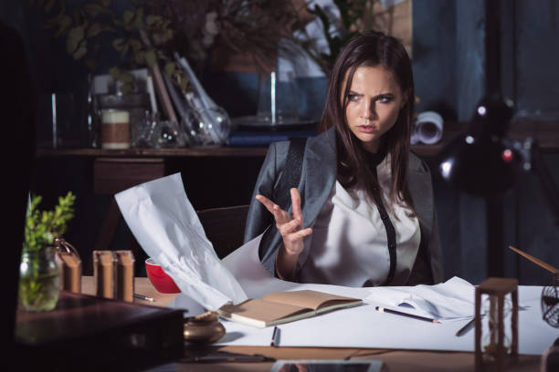 istock Young business woman throwing documents at camera 858583716