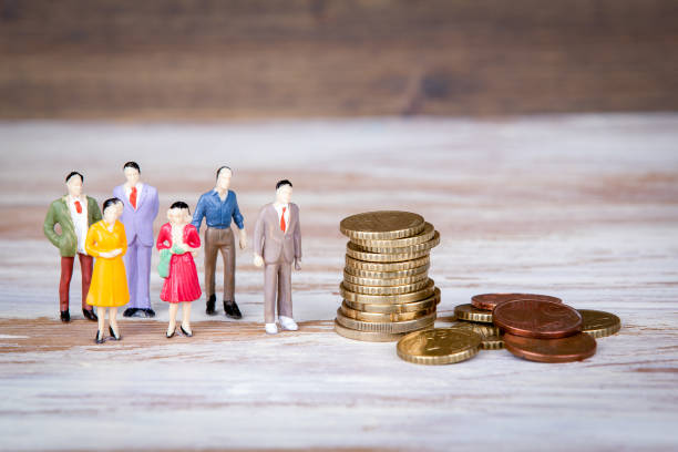 istock Making money, selling and competing. Colorful Human miniatures 858587198