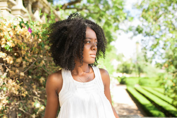 istock Pensive Young Black Woman Walking in Park 858591472