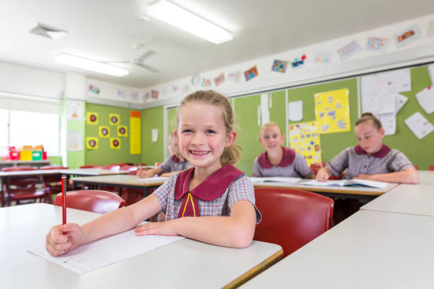 istock Education of Primary School Students Answering Questions in Class 858591510