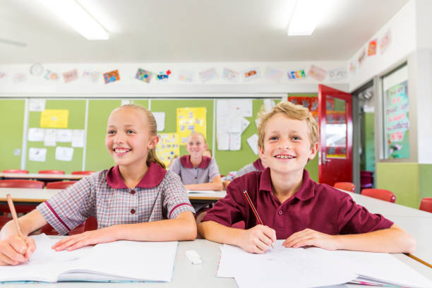 istock Education of Primary School Students Answering Questions in Class 858591516