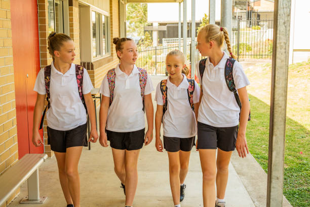 istock Girl Junior High School Students Arriving at School 858591584