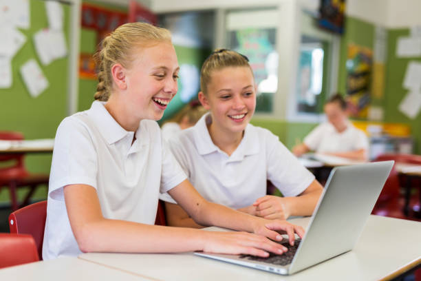 istock Education of Junior High School Girl Students Using Computers 858591592