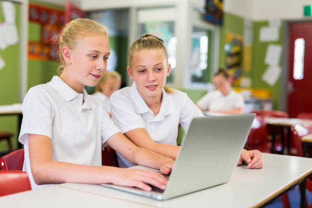 istock Education of Junior High School Girl Students Using Computers 858591598